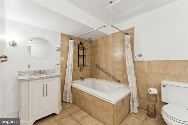 full bathroom with tiled shower / bath combo, tile patterned floors, toilet, and vanity