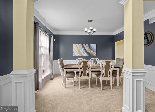 54 Durham Ln, Smyrna, DE 19977 - dining space with light colored carpet, ornamental molding, a chandelier, wainscoting, and a decorative wall