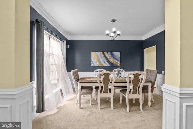 54 Durham Ln, Smyrna, DE 19977 - dining area with carpet flooring, a chandelier, crown molding, and wainscoting