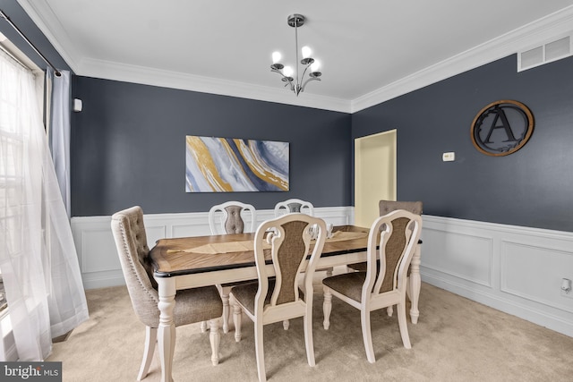 54 Durham Ln, Smyrna, DE 19977 - dining room featuring light carpet, a wainscoted wall, ornamental molding, and a decorative wall
