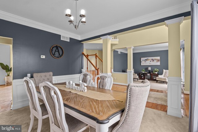 54 Durham Ln, Smyrna, DE 19977 - dining space with decorative columns, crown molding, wainscoting, a chandelier, and light colored carpet