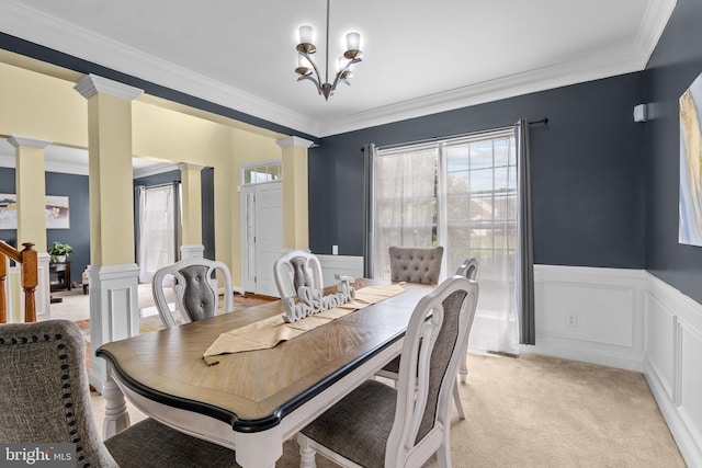 54 Durham Ln, Smyrna, DE 19977 - dining space with decorative columns, ornamental molding, a wainscoted wall, a decorative wall, and light colored carpet