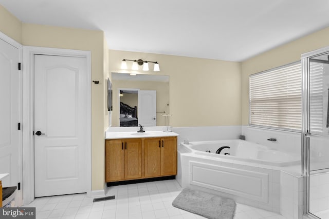 54 Durham Ln, Smyrna, DE 19977 - ensuite bathroom with a bath, vanity, and tile patterned flooring