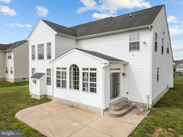 54 Durham Ln, Smyrna, DE 19977 - rear view of house featuring entry steps, a patio area, and a yard