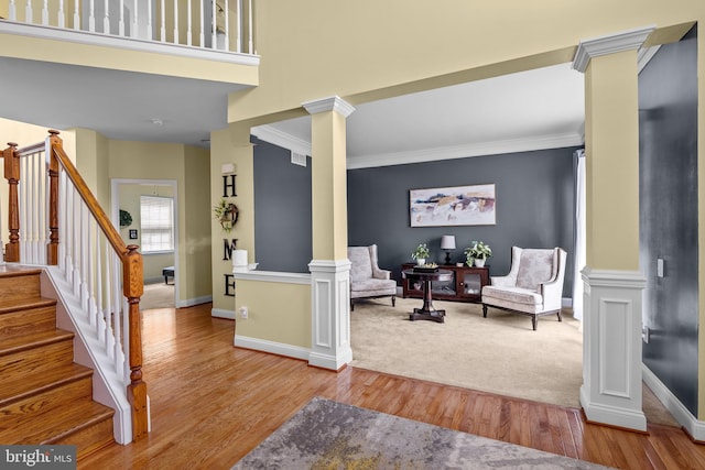 54 Durham Ln, Smyrna, DE 19977 - foyer with ornate columns, baseboards, wood finished floors, ornamental molding, and stairway