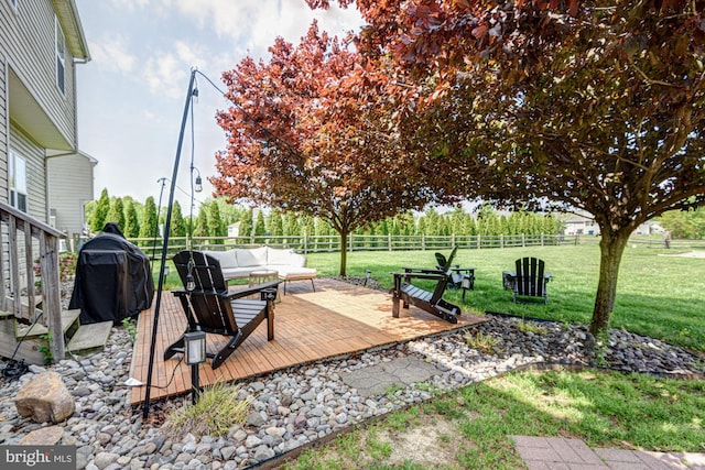 view of yard with a wooden deck, an outdoor hangout area, and a fenced backyard