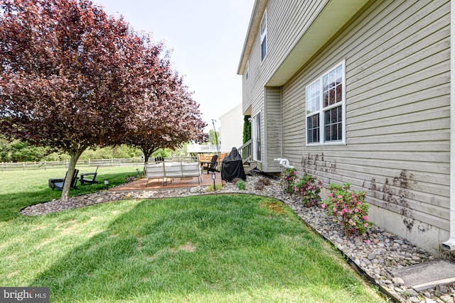 view of yard with fence and a patio area