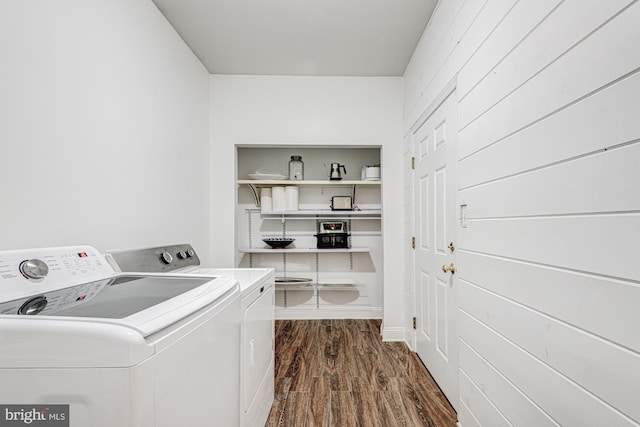 laundry room with laundry area, dark wood-style flooring, and washer and dryer
