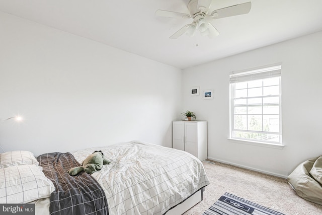bedroom with baseboards, carpet, and ceiling fan
