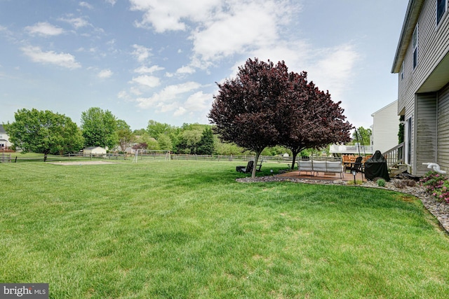 view of yard with fence and a patio area
