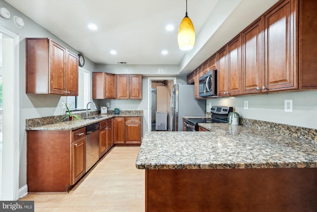 13446 Overbrook Ln, Bowie, MD 20715 - kitchen featuring stainless steel appliances, light wood-type flooring, a sink, brown cabinets, and recessed lighting