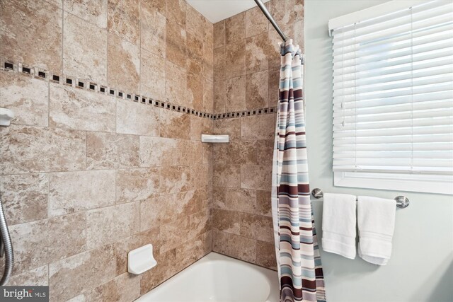 13446 Overbrook Ln, Bowie, MD 20715 - bathroom featuring shower / bath combo with shower curtain and healthy amount of natural light
