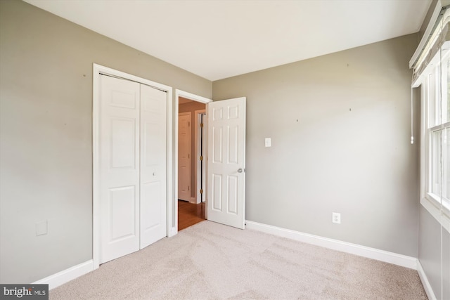 13446 Overbrook Ln, Bowie, MD 20715 - unfurnished bedroom featuring carpet flooring, a closet, and baseboards