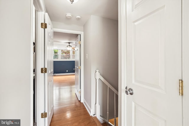 13446 Overbrook Ln, Bowie, MD 20715 - hallway featuring light wood-style flooring, an upstairs landing, and baseboards