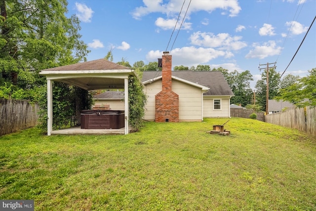 13446 Overbrook Ln, Bowie, MD 20715 - back of property with a hot tub, a gazebo, and a chimney