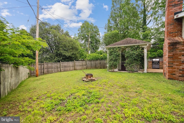 13446 Overbrook Ln, Bowie, MD 20715 - view of yard featuring an outdoor fire pit