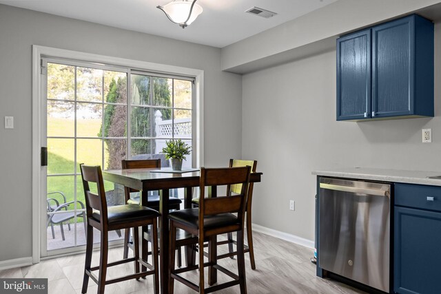 dining room featuring baseboards and visible vents