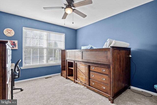 bedroom with baseboards, ceiling fan, and carpet flooring