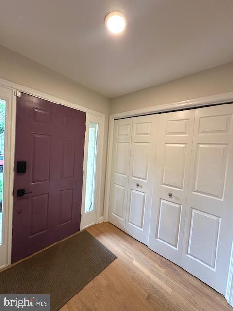 entrance foyer with light wood-style floors
