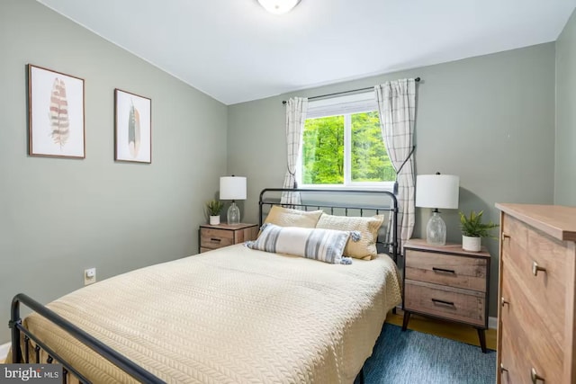 bedroom with lofted ceiling