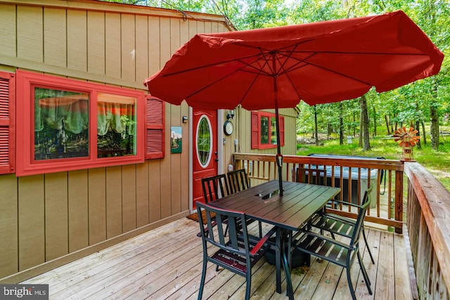 wooden deck with outdoor dining space