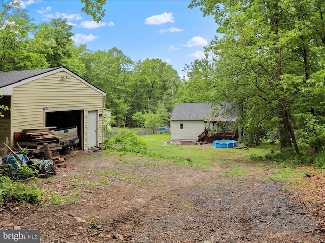 74 Red Maple Ln, Harpers Ferry, WV 25425 - view of yard with an outdoor structure and a garage