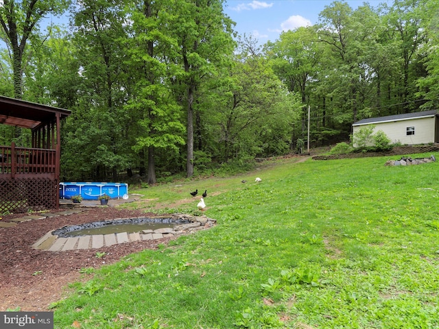 74 Red Maple Ln, Harpers Ferry, WV 25425 - view of yard with a deck and an outdoor pool