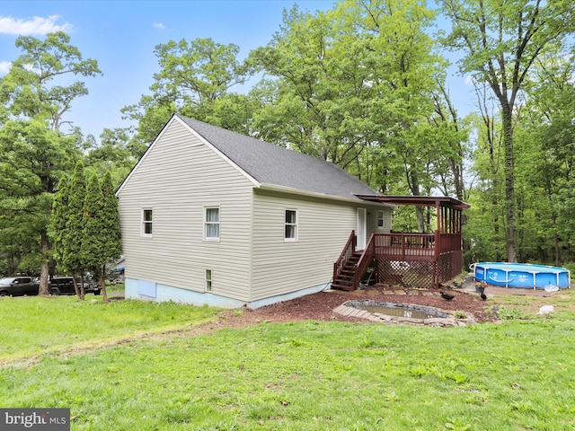 74 Red Maple Ln, Harpers Ferry, WV 25425 - exterior space with a yard, stairway, a wooden deck, and an outdoor pool