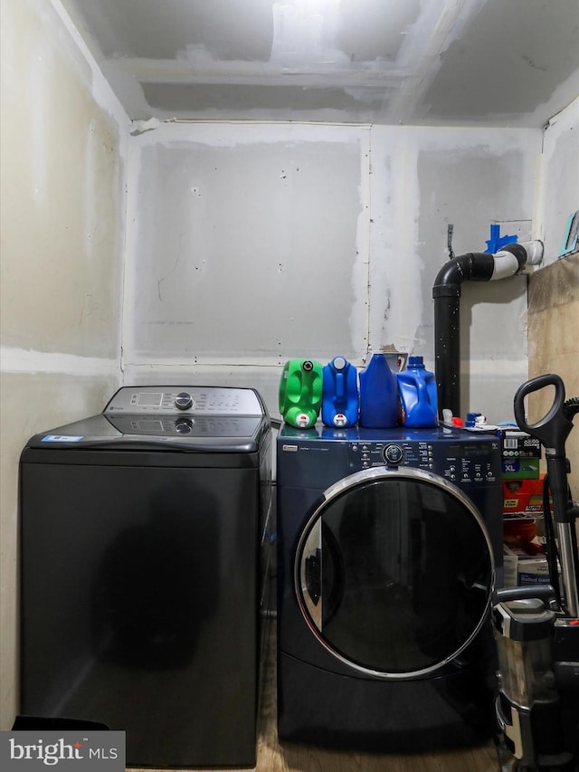 74 Red Maple Ln, Harpers Ferry, WV 25425 - laundry area featuring washing machine and clothes dryer, wood finished floors, and laundry area