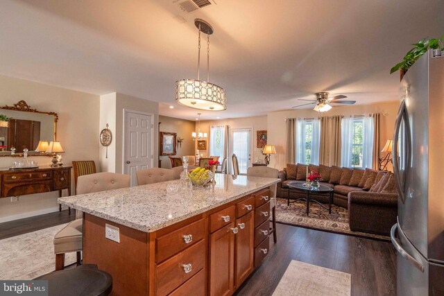 252 Parkside Ct, Woodstock, VA 22664 - kitchen featuring freestanding refrigerator, open floor plan, dark wood-style flooring, a breakfast bar area, and recessed lighting