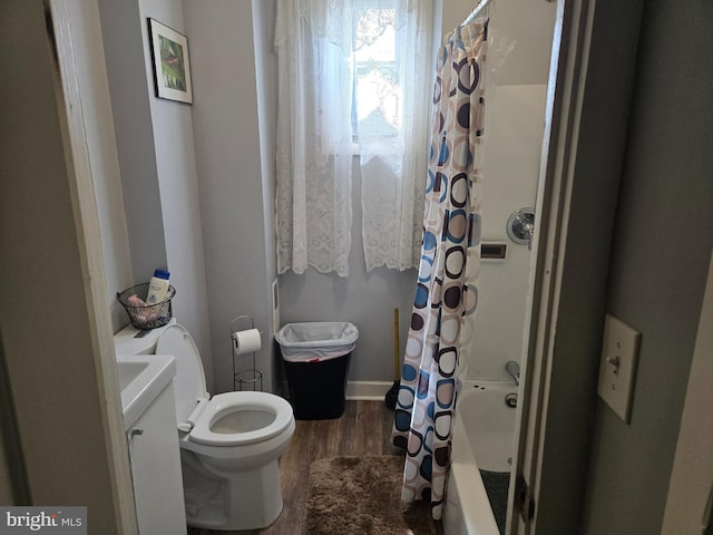 933 Bennett Pl, Baltimore, MD 21223 - bathroom featuring wood finished floors, toilet, and shower / bath combo