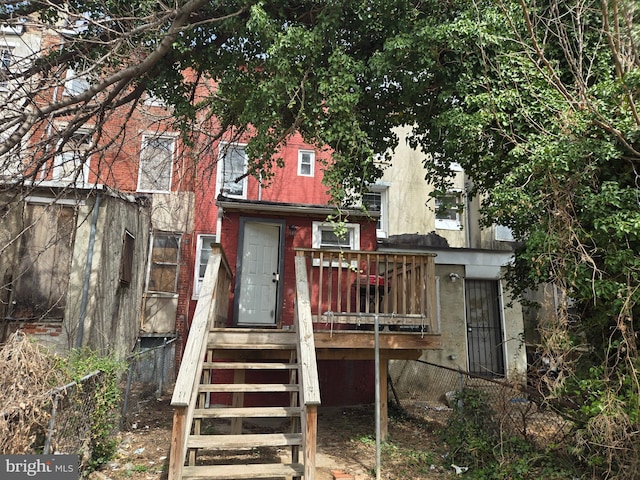 933 Bennett Pl, Baltimore, MD 21223 - back of house featuring fence, entry steps, and brick siding