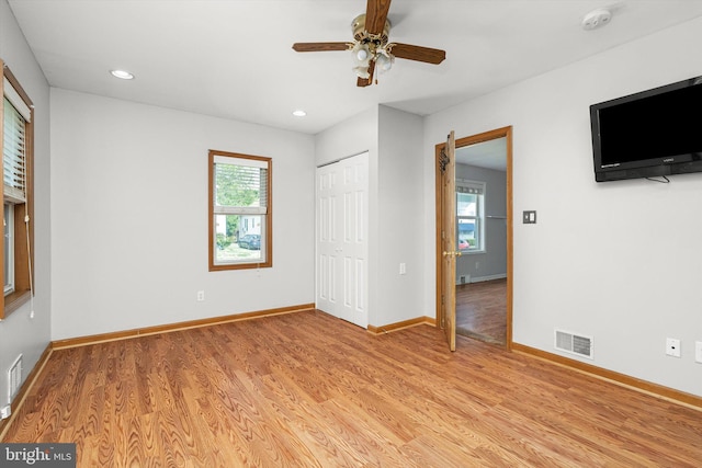 unfurnished bedroom featuring ceiling fan, light wood-style floors, recessed lighting, baseboards, and visible vents