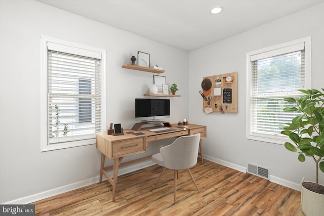 home office featuring visible vents, recessed lighting, baseboards, and light wood-type flooring