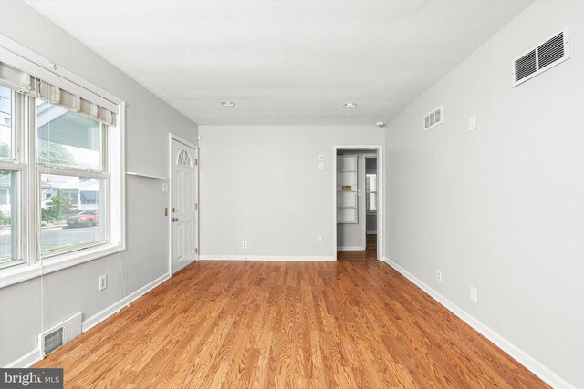 empty room with visible vents, recessed lighting, and light wood-style floors