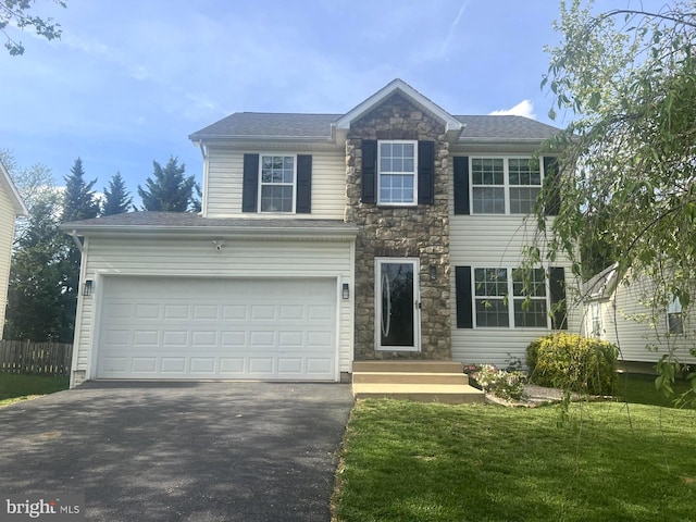 431 E Beltline Ave, Ranson, WV 25438 - view of front of property featuring asphalt driveway, a garage, and stone siding
