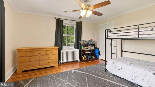477 Linton Hill Rd, Newtown, PA 18940 - bedroom featuring crown molding, radiator, ceiling fan, and wood finished floors