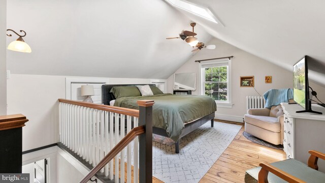 477 Linton Hill Rd, Newtown, PA 18940 - bedroom with wood-type flooring, lofted ceiling, radiator heating unit, and ceiling fan