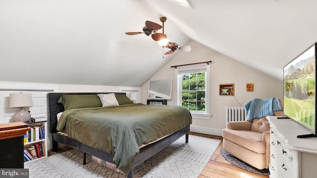 477 Linton Hill Rd, Newtown, PA 18940 - bedroom with lofted ceiling, light wood-style floors, baseboards, radiator heating unit, and a ceiling fan