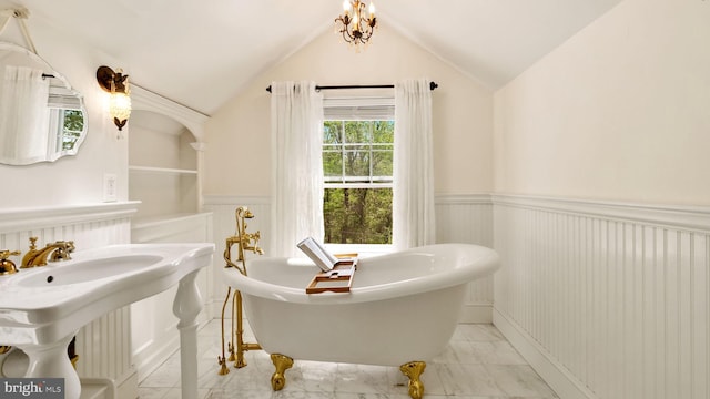 477 Linton Hill Rd, Newtown, PA 18940 - full bathroom featuring a freestanding tub, lofted ceiling, wainscoting, and marble finish floor