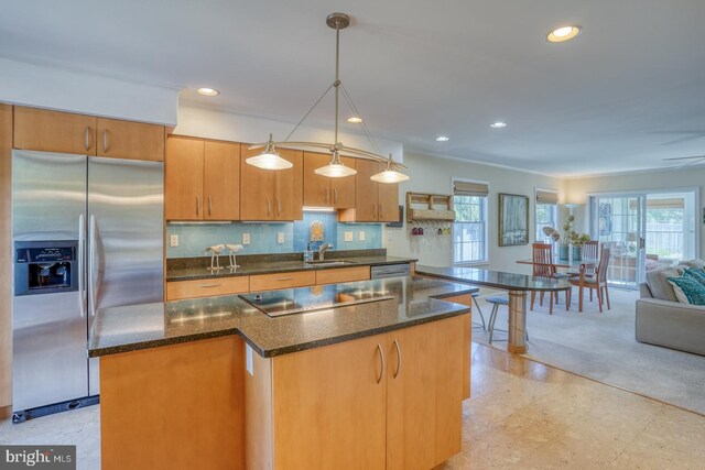 3201 Blue Heron Dr Unit 01, Rehoboth Beach, DE 19971 - kitchen with appliances with stainless steel finishes, a sink, open floor plan, recessed lighting, and a center island