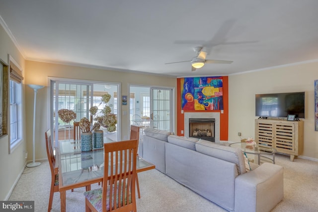 3201 Blue Heron Dr Unit 01, Rehoboth Beach, DE 19971 - living area with crown molding, ceiling fan, healthy amount of natural light, and carpet floors