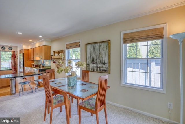 3201 Blue Heron Dr Unit 01, Rehoboth Beach, DE 19971 - dining space featuring light carpet, ornamental molding, baseboards, and recessed lighting