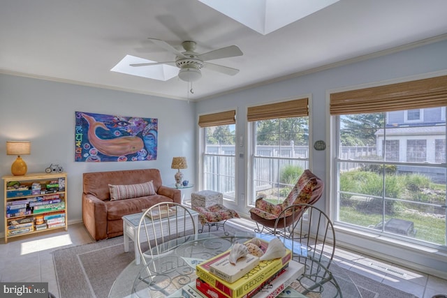 3201 Blue Heron Dr Unit 01, Rehoboth Beach, DE 19971 - sitting room with a skylight, a ceiling fan, plenty of natural light, ornamental molding, and tile patterned flooring