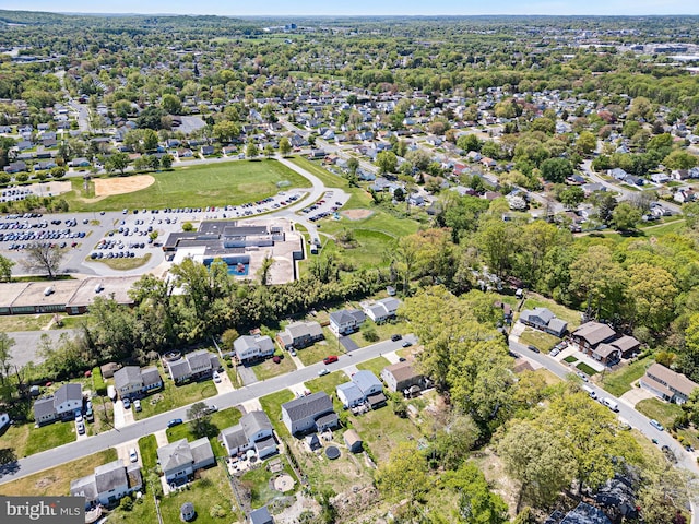 birds eye view of property with a residential view