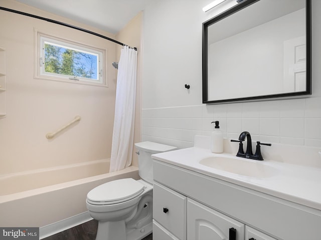 full bath featuring decorative backsplash, wood finished floors, vanity, toilet, and shower / tub combo with curtain