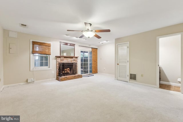 12104 Stallion Ct, Woodbridge, VA 22192 - unfurnished living room featuring a fireplace, carpet, a ceiling fan, and visible vents