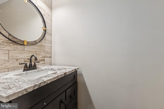 12104 Stallion Ct, Woodbridge, VA 22192 - bathroom with vanity and decorative backsplash