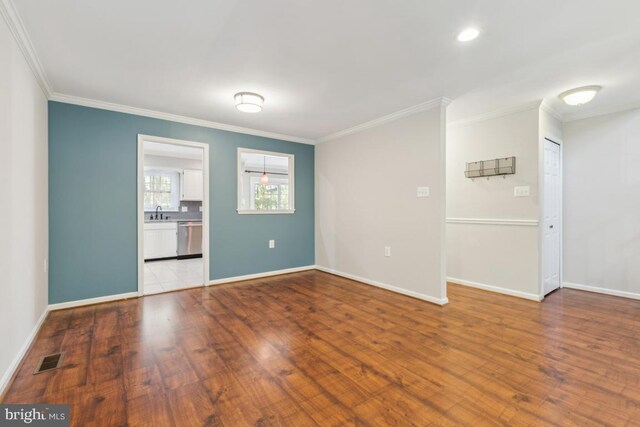 12104 Stallion Ct, Woodbridge, VA 22192 - unfurnished room featuring baseboards, ornamental molding, and wood finished floors