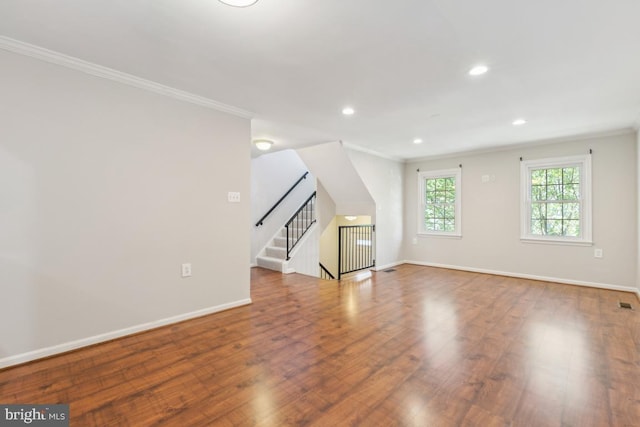 interior space featuring baseboards, recessed lighting, and wood finished floors